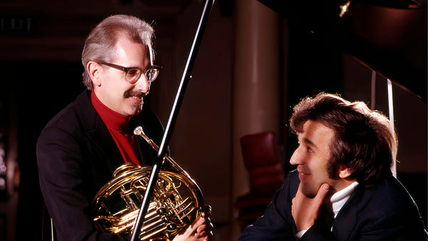 Barry Tuckwell performing chamber music with his trio and wind quartet, touring internationally and playing alongside violinist Brenton Langbein and pianist Maureen Jones.