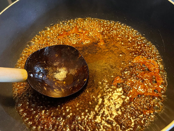 Sugar caramelizing over a hot saucepan - Serendip Delights Lavariya Recipe Step 2