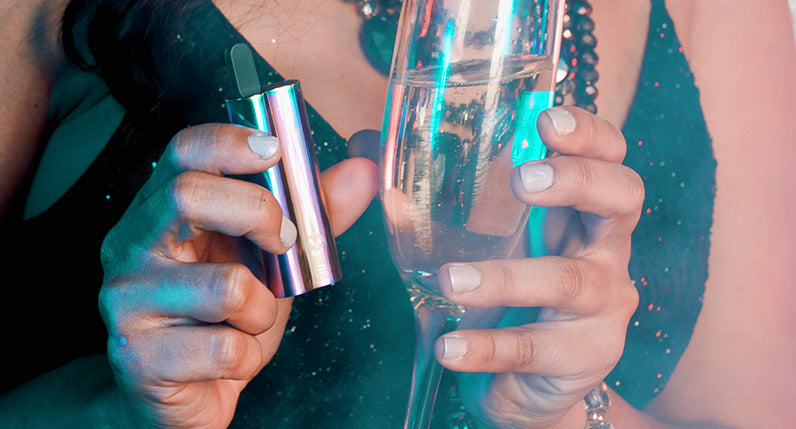 Woman holding champagne with the Full Color Sutra Auto