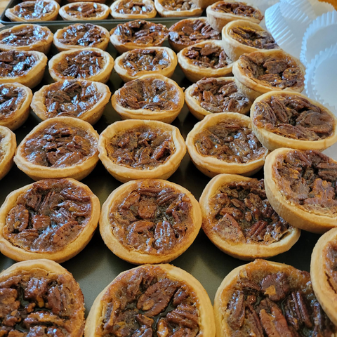 An aerial view of butter tarts on a table