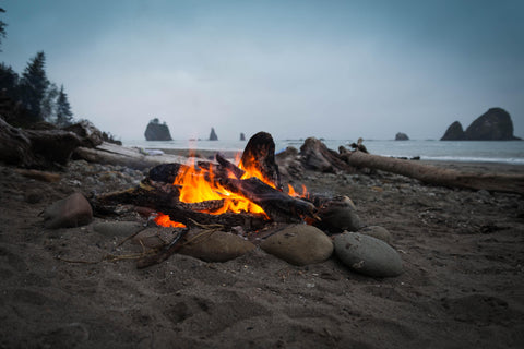 A photo of a campfire on the beach