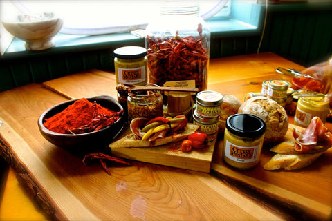 An image of a charcuterie board and various food products of Cressy Mustard