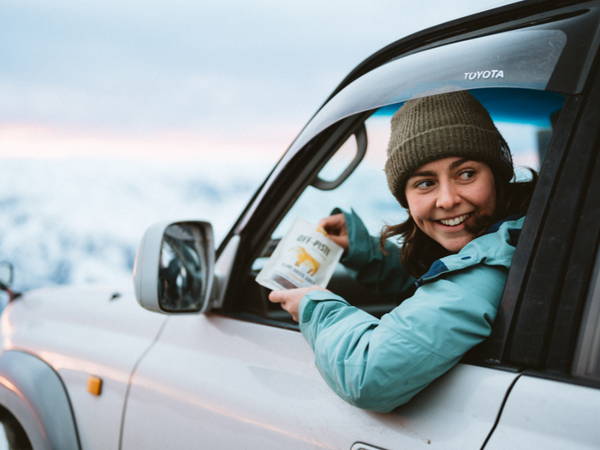 Girl in car eating Off-Piste Provisions jerky