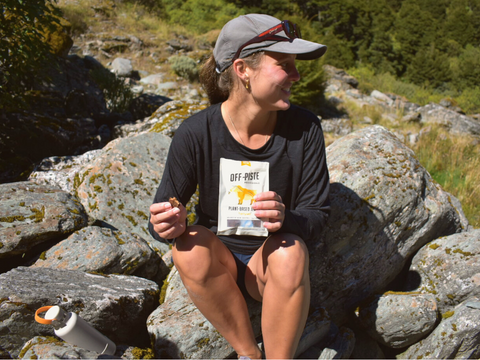 Hiker girl eating jerky