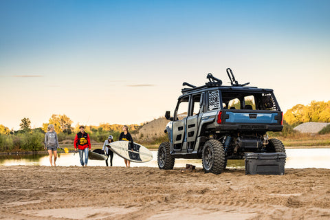 Polaris Xpedition lifestyle photo with surfers.