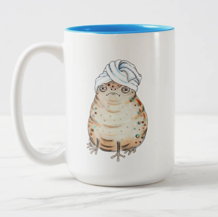 https://cdn.shopify.com/s/files/1/0550/3041/5551/products/Toad_in_a_Towel_Mug_1024x1024.png?v=1702407681