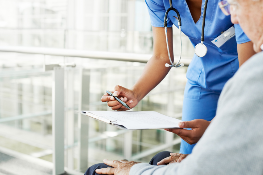 nurse talking to a patient about their chart