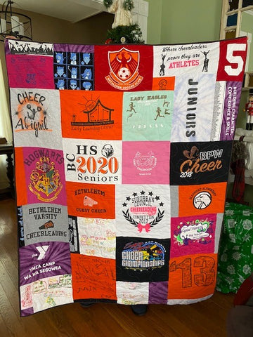 T-shirt quilt for a graduating senior made of shirts from grades K-12!