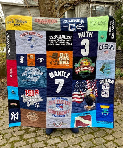 Memory quilt commissioned by a person who's father had passed away as a gift to her mother.  We worked to highlight his favorite things, travel and the Yankees!