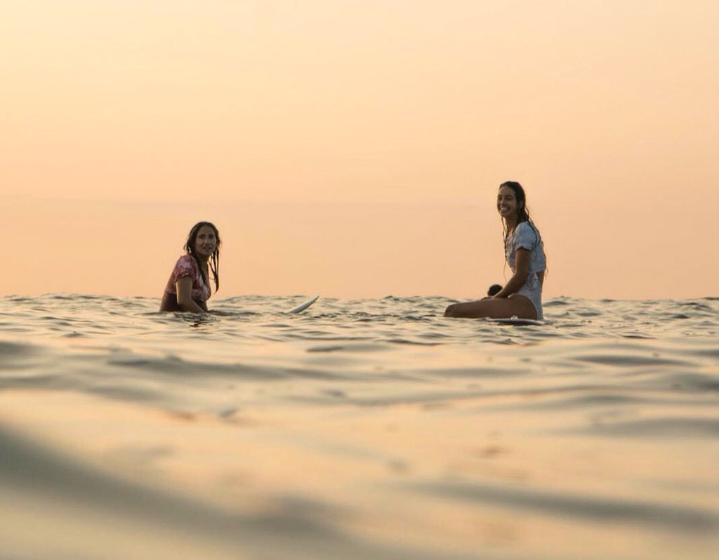 Renata and Laure Myr sunset surf