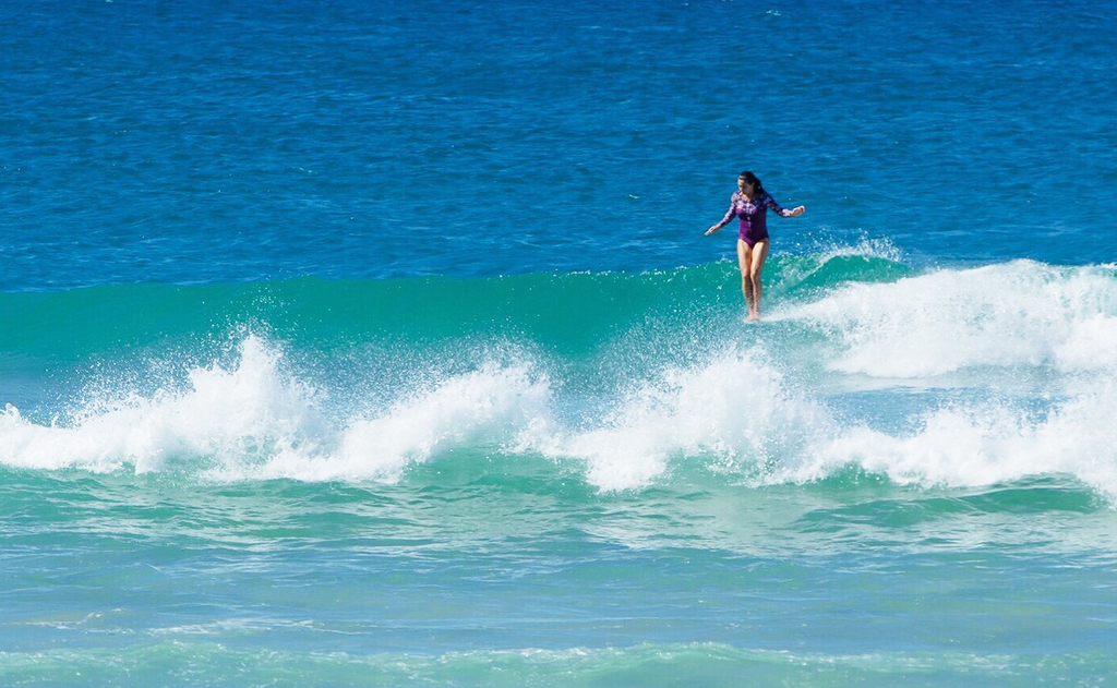 longboarder hanging ten in the Lafitenia Surfsuit Lore of the Sea