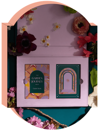 The Garden Journey's custom Keepsake Box lies open on a flower-strewn table