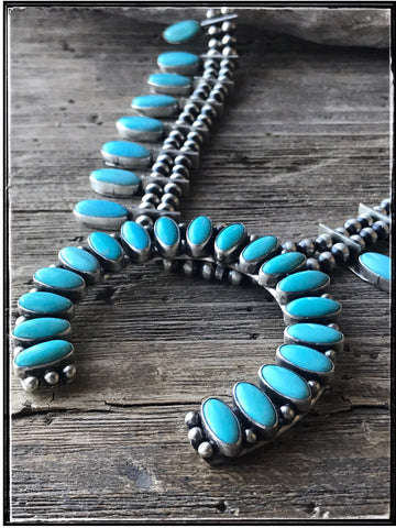 Turquoise and sterling naja necklace.