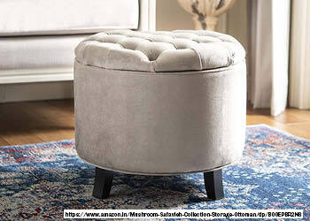 A photo of an ottoman, which is a low upholstered seat or footstool without a backrest. The ottoman may have a round, square, or rectangular shape, and it may be covered in various fabrics or leather. The photo may show the ottoman in a variety of settings, such as a living room, bedroom, or dressing room. 