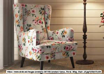 A photo of a wing chair, which is an upholstered armchair with a high backrest and side panels that extend from the back to the armrests, resembling wings. The chair may have a traditional design with curved lines and ornate details or a more modern look with simple and clean lines. The photo may show the chair in a variety of settings, such as a living room, study, or bedroom. 