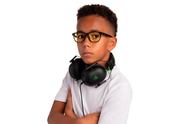 young boy wearing screen glasses for kids