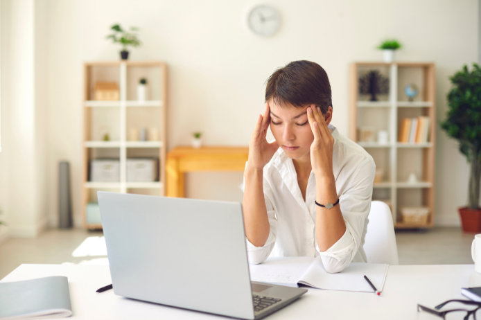 a woman experiencing eye strain headache