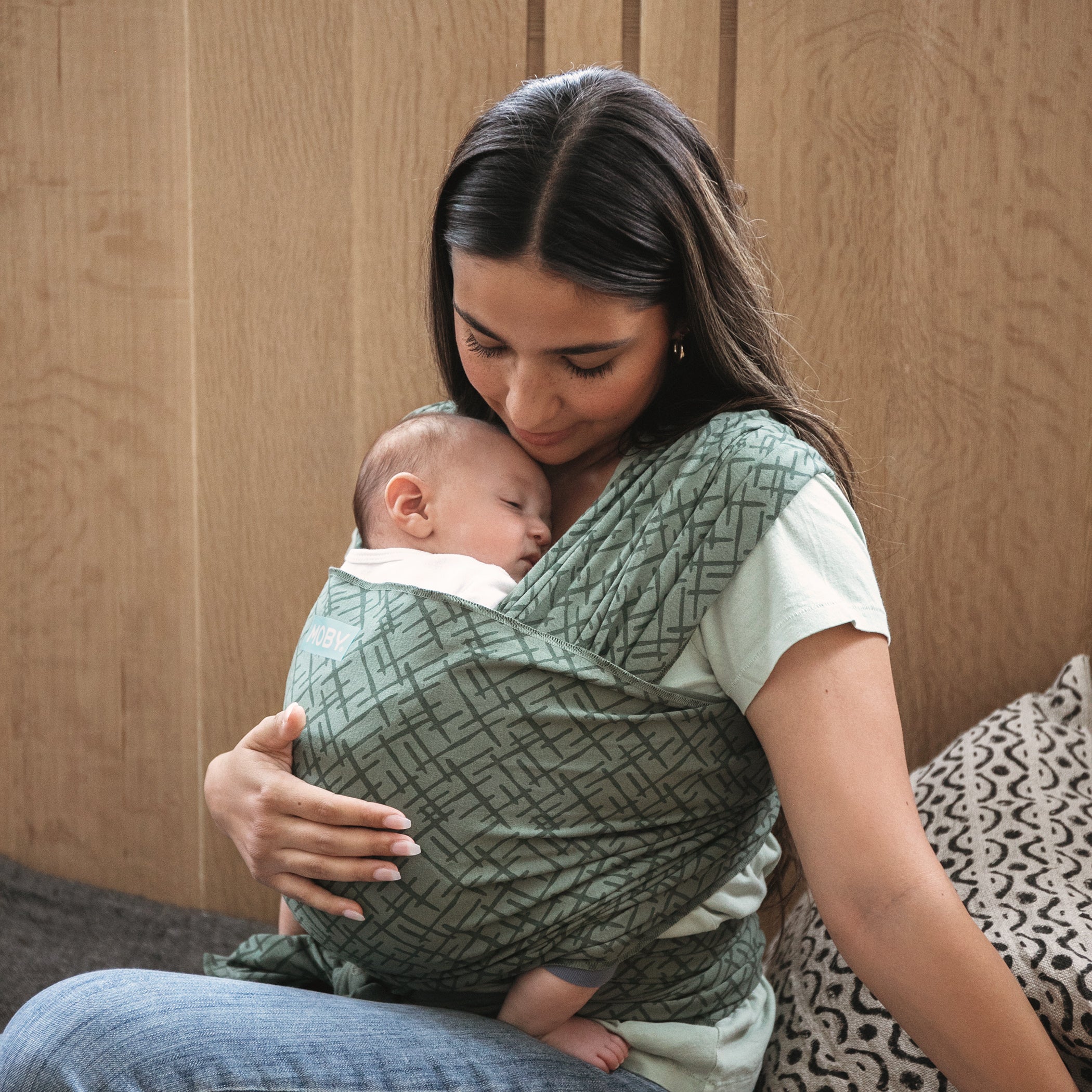 Mum and baby with the MOBY Classic Wrap in the Olive Etch print. Babywearing benefits - Belly Beyond NZ.