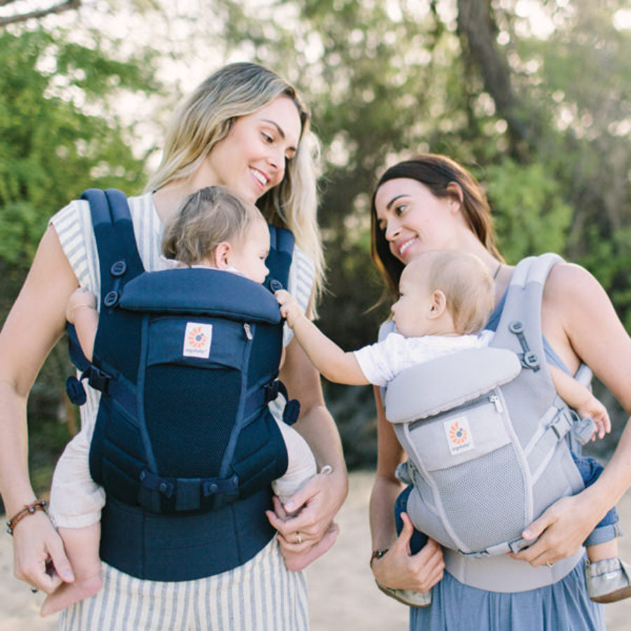 Mums outdoors with their baby carriers