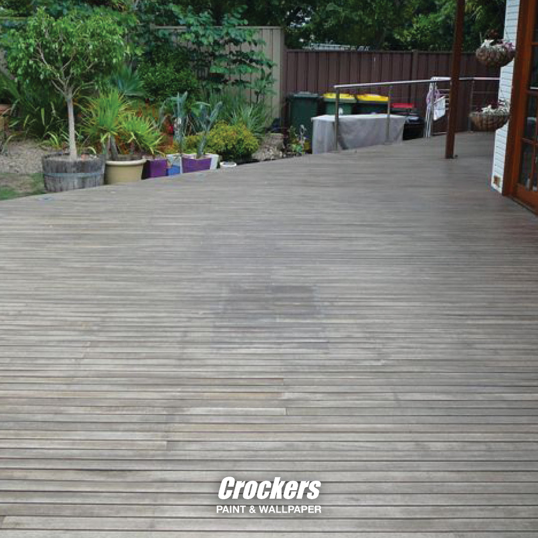 Before: A grey and weathered deck in need of re-staining