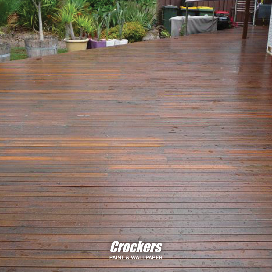 Before: A grey and weathered deck in need of re-staining
