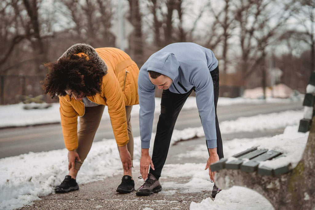 Two people keeping active to improve circulation and foot warmth