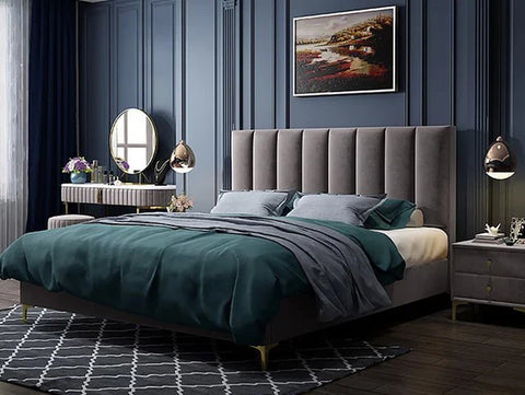 Velvet bed frame with mattress in a blue bedroom