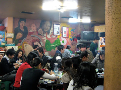 People at a stir-fried chicken restaurant