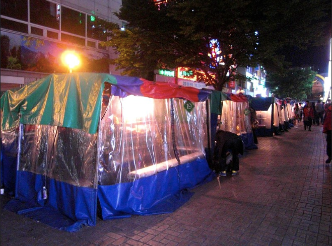 A pojangmacha or covered tent at night