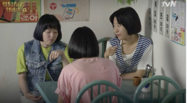 Three girls eating at a table together