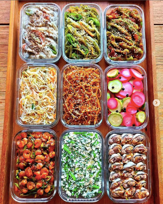 Nine containers of different banchan