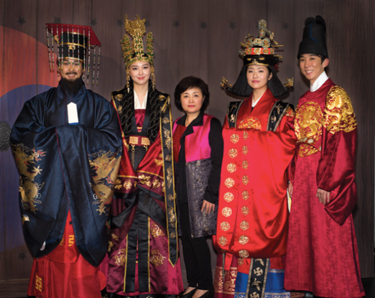Four models in imperial hanboks with modern designer