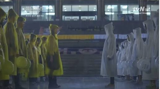A standoff between girls in yellow and girls in white