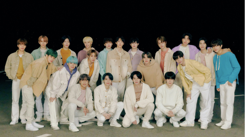 A large group of men in beige and pastel colors
