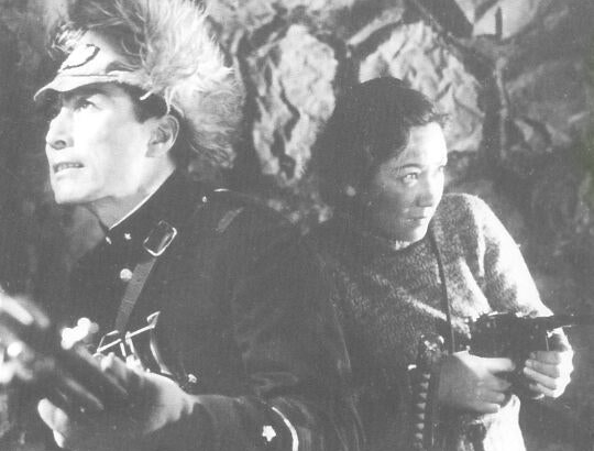 A Japanese soldier and Korean woman holding guns