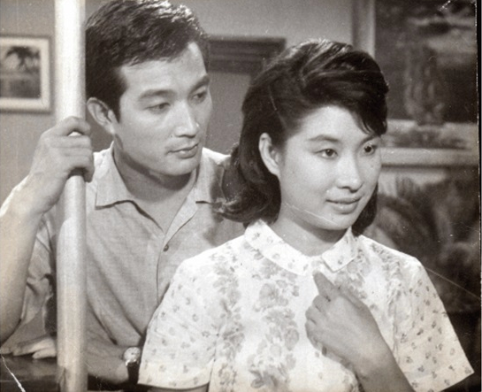 A black-and-white film still of Shin Seong-il and Um Aing-ran