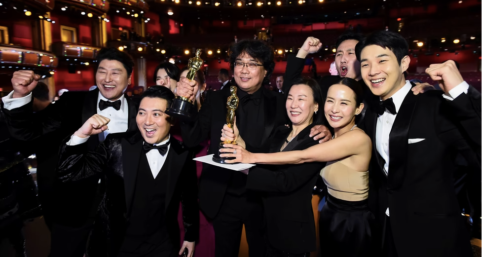 The cast and crew of "Parasite" celebrating wins at the Oscars