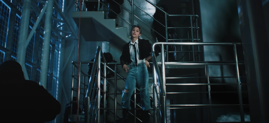 Felix standing on a metal set of stairs