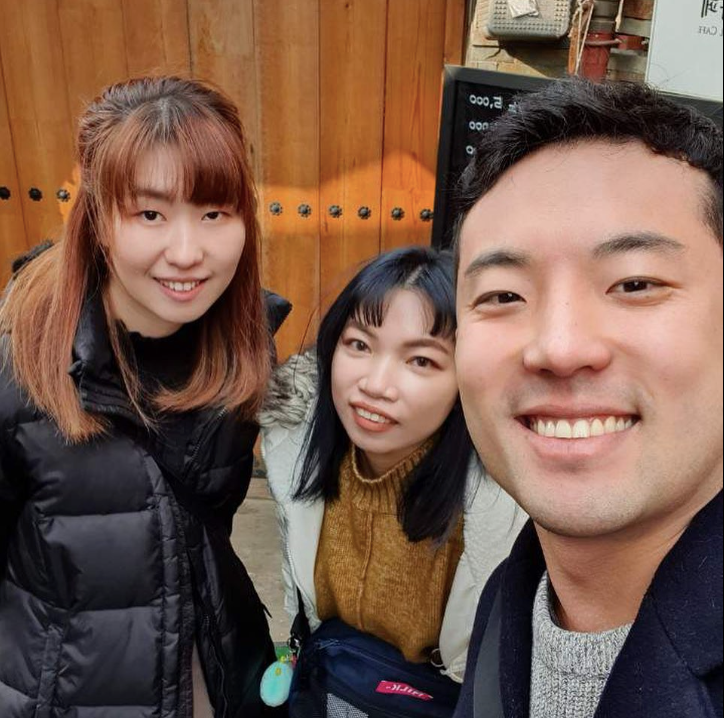 A Korean man with two Asian women