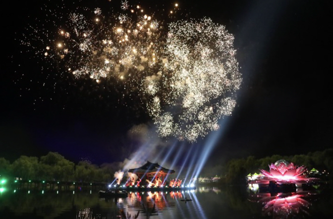 Fireworks and lights on the water at the Buyeo Lotus Festival at night