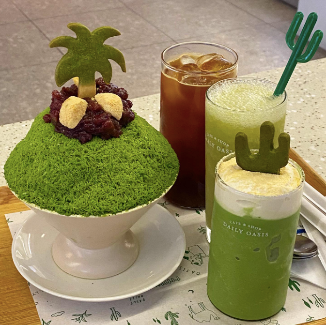 Matcha bingsu, iced coffee, and green iced coffees with palm trees and cacti on top