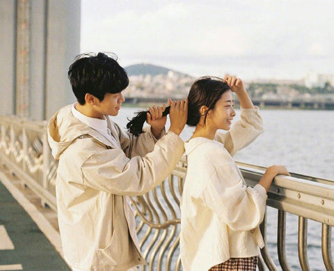 Korean couple tying hair