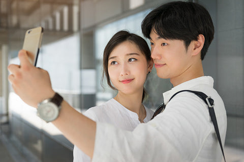 Young couple taking selfies 