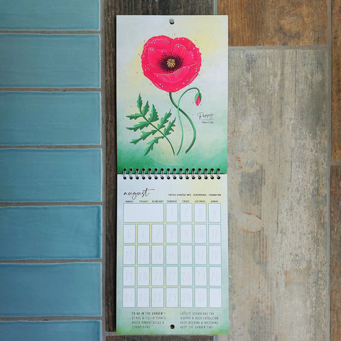 Photo of a wall calendar with poppy design