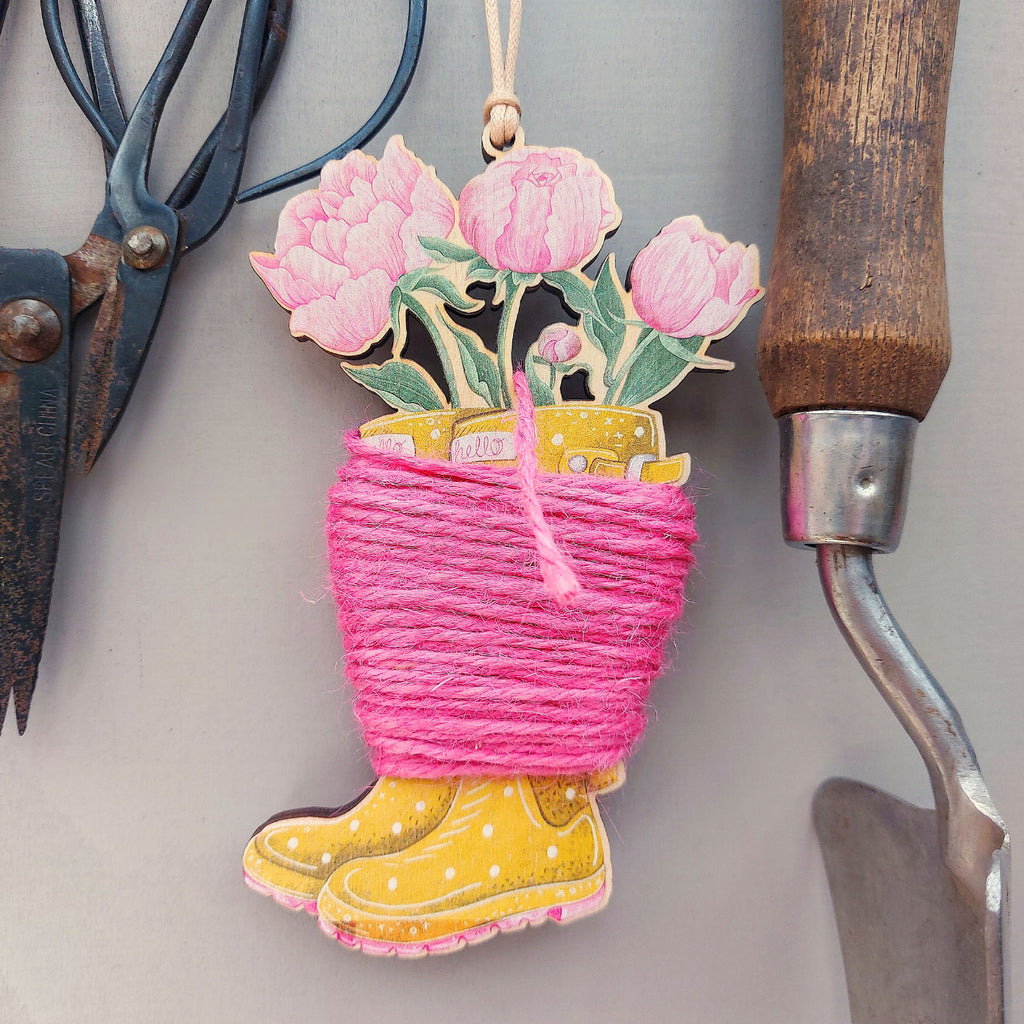 yellow wellington boot shaped string holder with pink twine