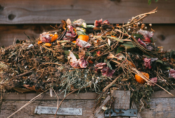 garden compost heap with wooden sides