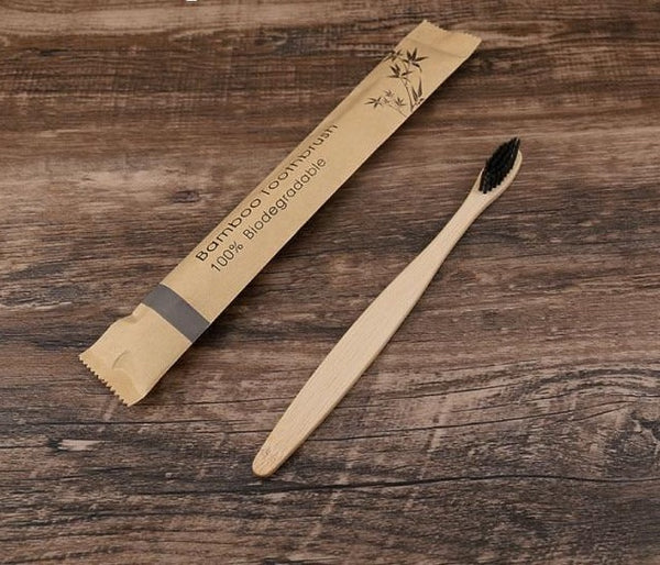 Image for bamboo wooden toothbrush with black bristles.