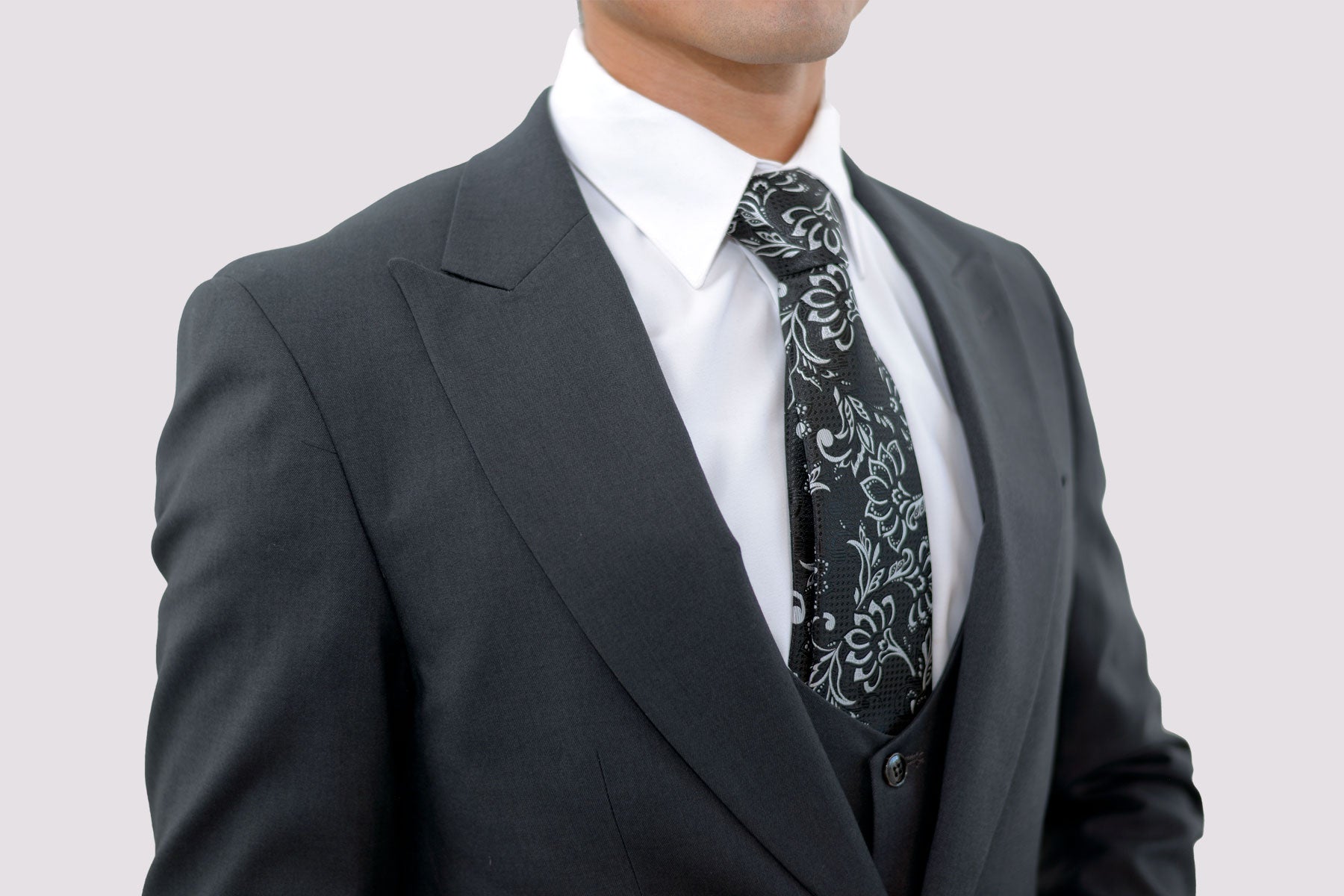 charcoal suit with large peak lapel