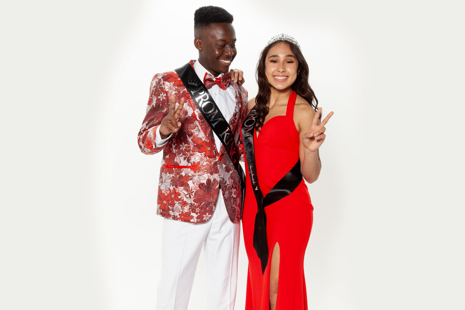 guy wearing red prom blazer with prom date king and queen