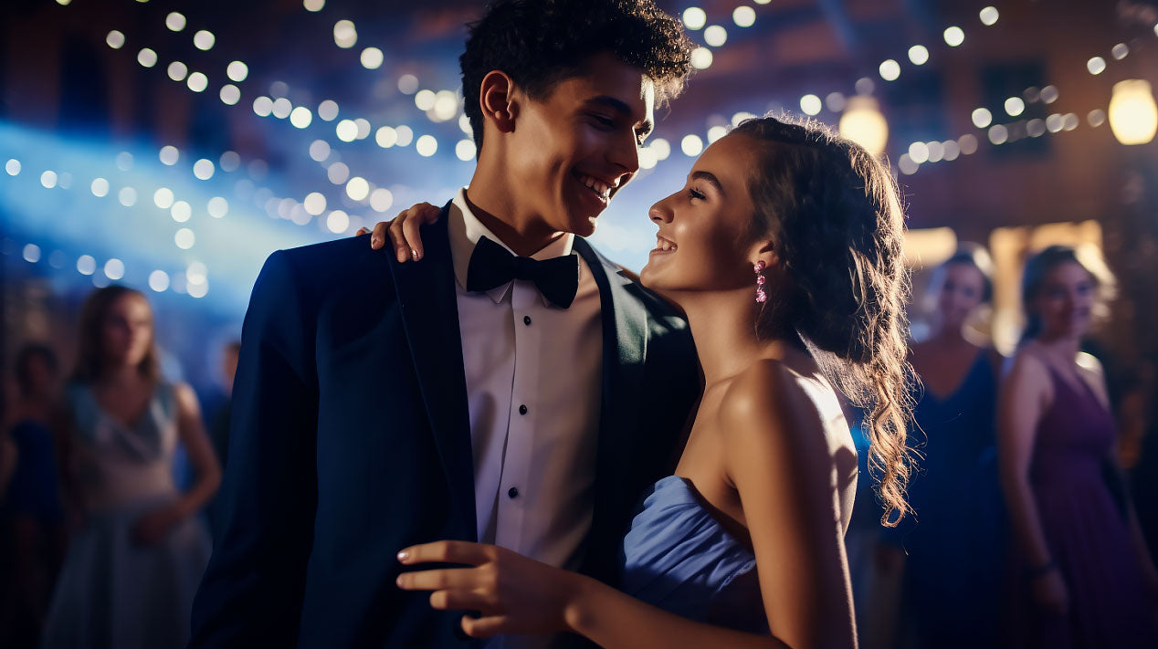 prom guy wearing blue suit with girl in prom dress